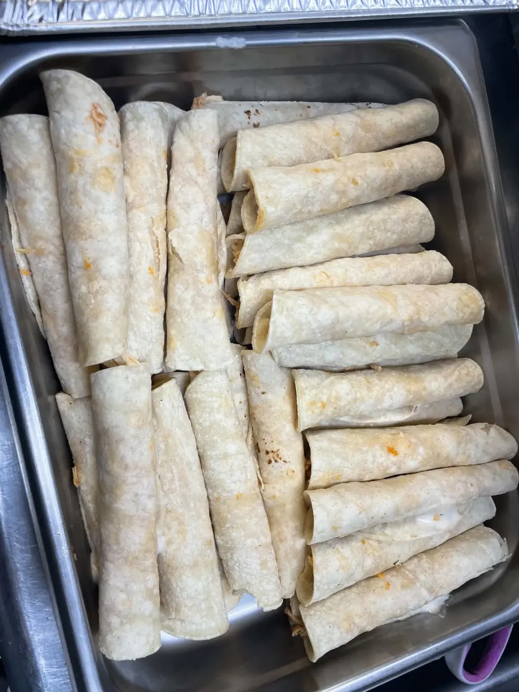 Rolled tacos prepared by hand